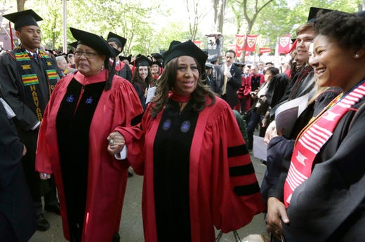 Singer Aretha Franklin, center, walks in a procession during Harvard University commencement ceremonies, Thursday, May 29, 2014, in Cambridge, Mass. Franklin was presented with an honorary Doctor of Arts degree during the ceremony. (AP Photo/Steven Senne) ORG XMIT: o3