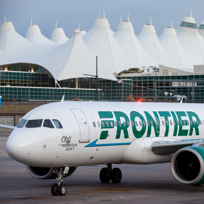 A Frontier Airbus A320neo pulls into a gate at Denver International Airport in May 2017.