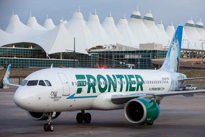 A Frontier Airbus A320neo pulls into a gate at Denver International Airport in May 2017.