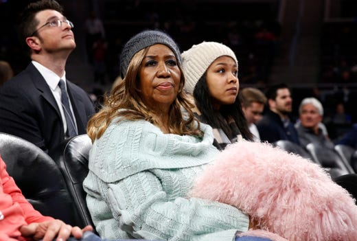 Aretha Franklin watches during an NBA basketball game between the San Antonio Spurs and Detroit Pistons in Auburn Hills, Mich., Wednesday, Feb. 11, 2015. (AP Photo/Paul Sancya) ORG XMIT: MIPS115