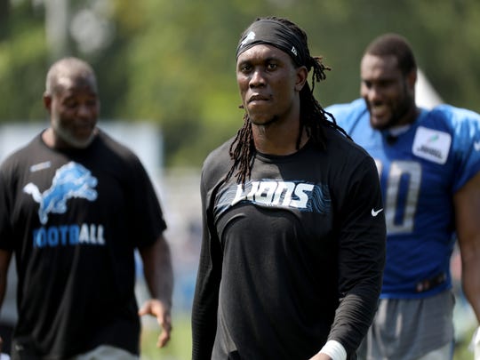 Lions defensive end Ziggy Ansah walks off the field after practice during training camp Aug. 14, 2018, in Allen Park.