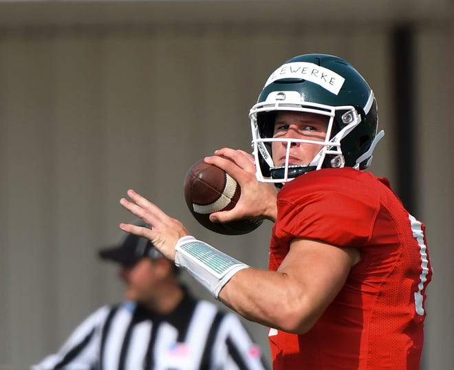 MSU QB Brian Lewerke throws Tuesday, Aug. 14, 2018, during practice at the MSU practice field.