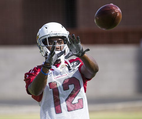 Wide receiver John Brown catches the ball on the sideline at a Cardinals practice last season.