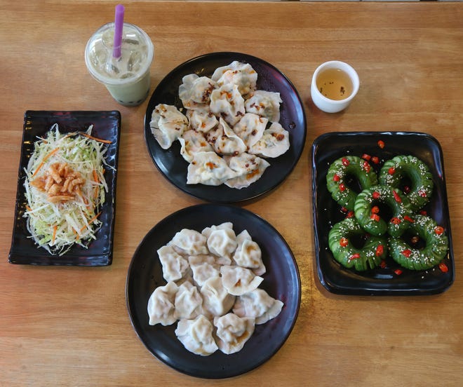 Clockwise from left, the flavor salad, bubble green tea, shrimp, egg & chive dumplings, green tea, layered cucumber salad and pork & scallion dumplings at Palace Dumplings in Wappingers Falls on August 9, 2018. 