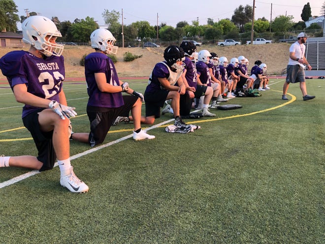 The Shasta High Wolves varsity football team practices outdoors for the first time this fall on Monday, Aug. 13.