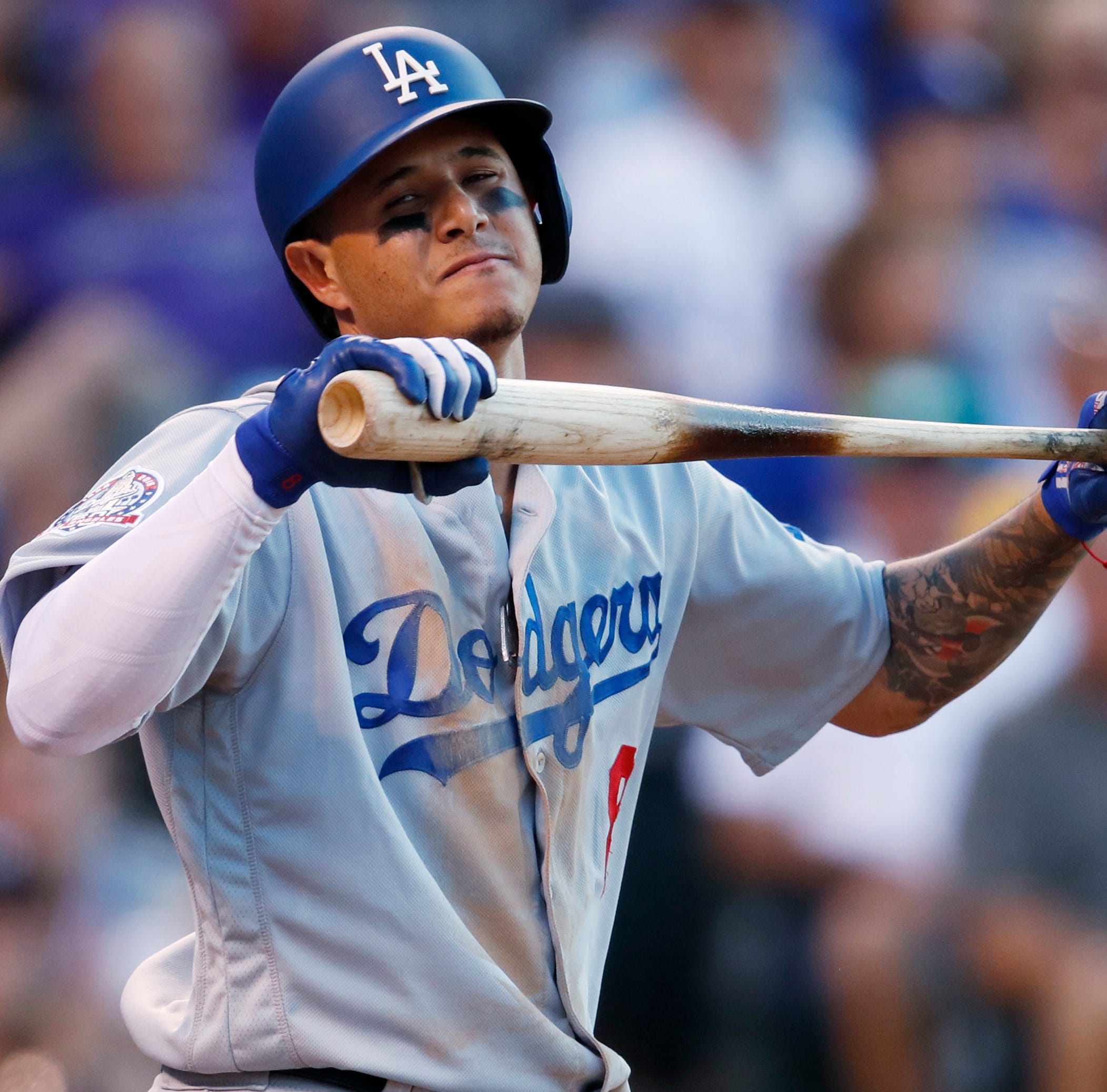 Dodgers shortstop Manny Machado reacts after striking out against the Rockies.