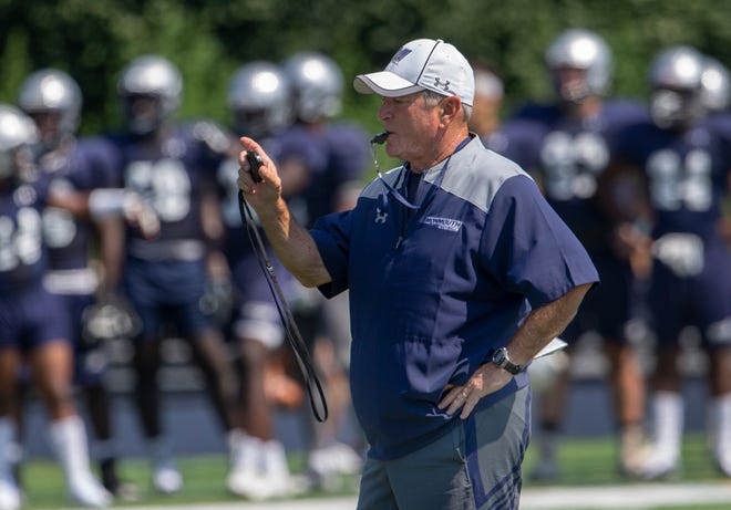 Monmouth University Head Football Coach Kevin Callahan times plays during Monmouth University football practice on August 15, 2018 in West Long Branch, NJ. 