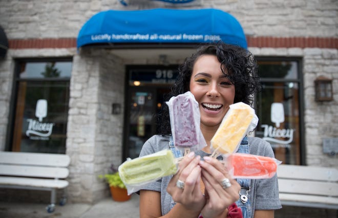 Erica Guerrero poses with four different ice cream treats at Nicey, where she works in Broad Ripple, Wednesday, Aug. 15, 2018. 