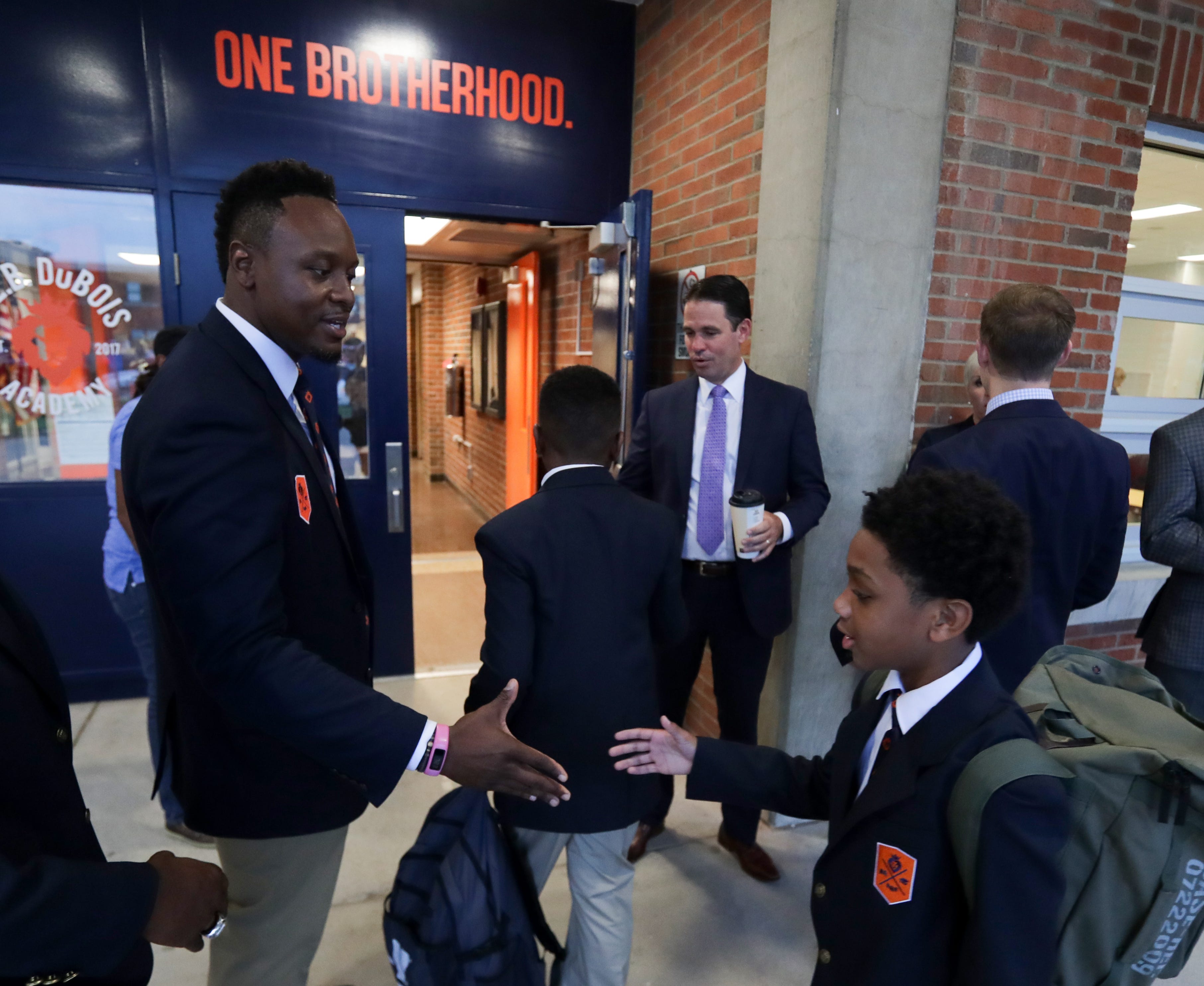 JCPS Superintendent Marty Pollio and W.E.B. DuBois Principal Robert Gunn Jr. greet students on the first day of school in 2018.