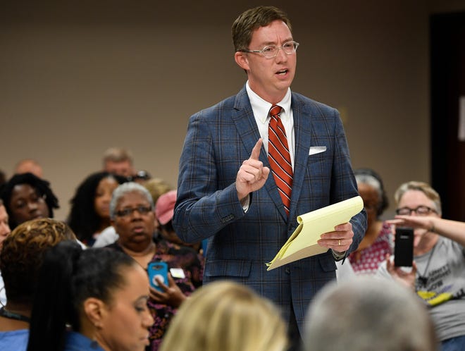 Austin McMullen, attorney for the Nashville Fraternal Order of Police, addresses the Davidson County Election Commission about the certification of a petition to put a community review board over the police department on the November general election ballot during the commission's meeting Wednesday, Aug. 15, 2018, in Nashville, Tenn.