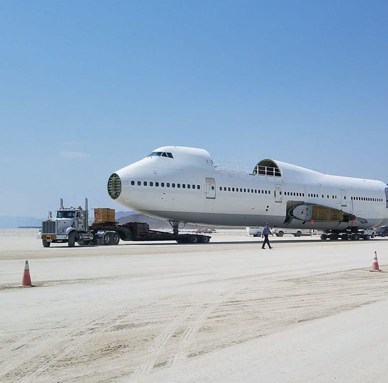 Burning Man camp Big Imagination hauled a partially reconstructed 747 aircraft onto the playa morning of Aug. 14, 2018. The wings will be shipped in separately. The airplane was registered as an art car and plans to be towed around the playa this yea