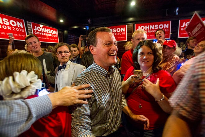 Minnesota gubernatorial candidate Jeff Johnson, center, is greeted by his supporters after returning to the watch party, Tuesday, Aug. 14, 2018, in Plymouth, Minn. (Alex Kormann/Star Tribune via AP)