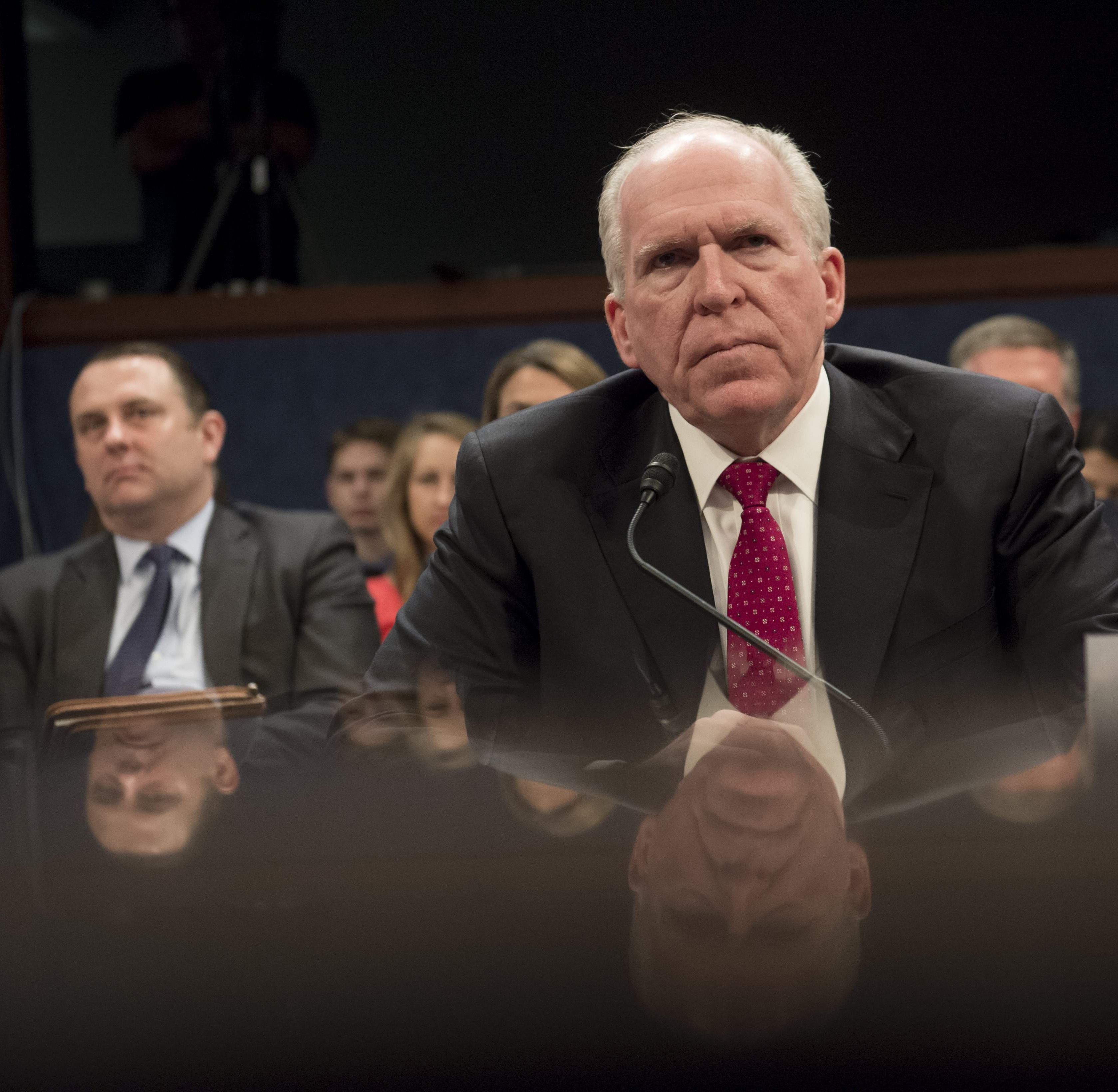 (FILES) In this file photo taken on May 23, 2017, former CIA Director John Brennan testifies during a House Permanent Select Committee on Intelligence hearing about Russian actions during the 2016 election on Capitol Hill in Washington, DC. - US Pres
