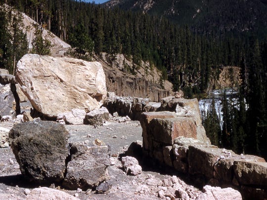 Boulders are seen on a road near Gibbon Falls in Yellowstone National Park after a magnitude-7.3 earthquake struck the area on Aug. 17, 1959.