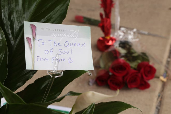 Flowers are left for late singer Aretha Franklin outside of New Bethel Baptist Church in Detroit on Thursday, August 16, 2018 following her passing.