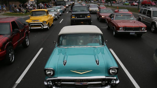 Chevrolet Belair is front in center of traffic...