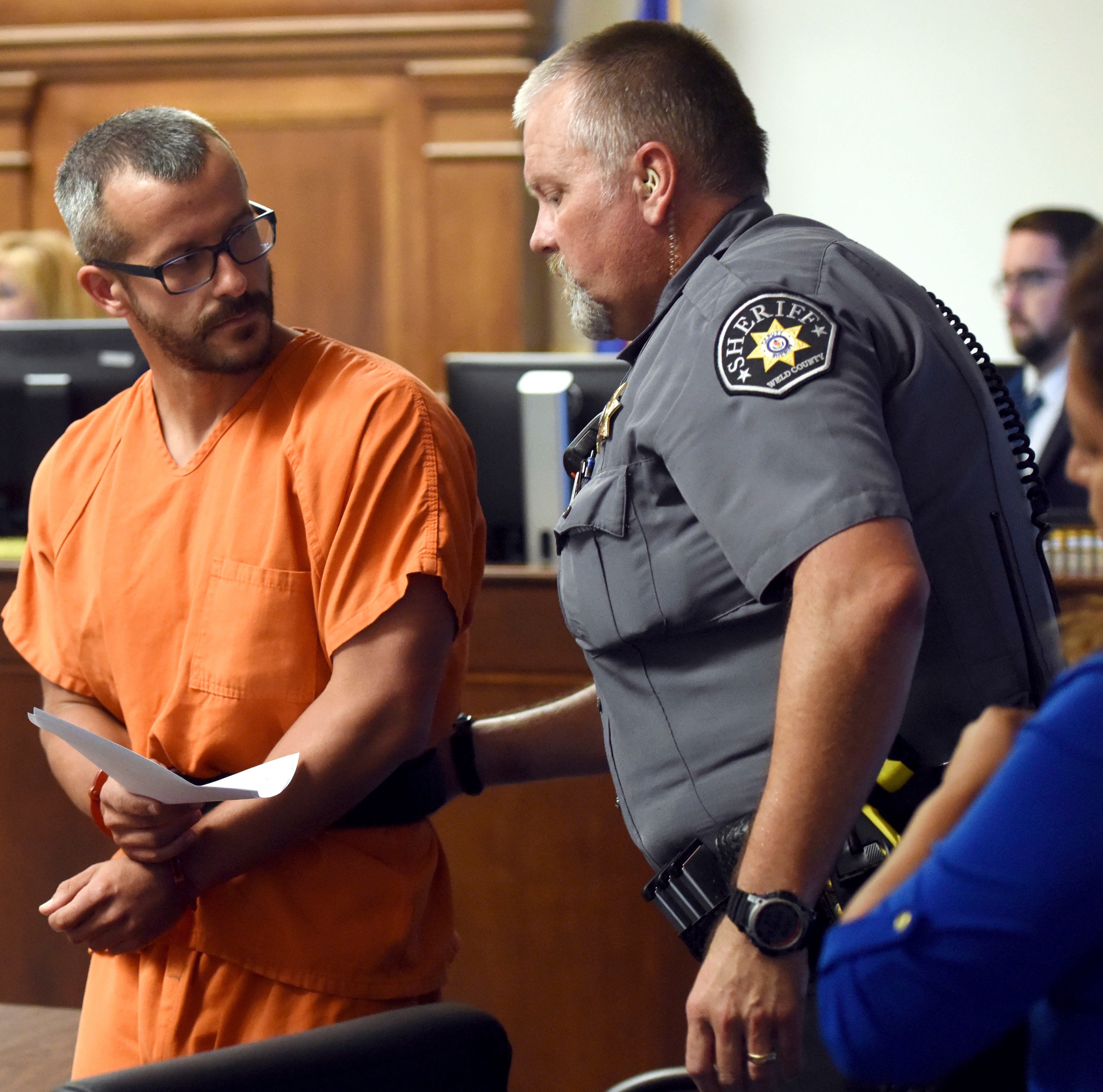 Christopher Watts glances back at a Weld County Sheriff's Deputy as he is escorted out of the courtroom at the Weld County Courthouse Thursday, Aug. 16, 2018, in Greeley, Colo. Watts, of Colorado, whose wife and daughters disappeared this week was ar