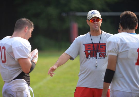 Photo of The Cardinals head coach Scott Mahoney as Running Back/LB in senior Frankie Negrini (L) of Pompton Lakes with his teammates are seen during their practice at Herschfield Park in Pompton Lakes on 08/16/18. 

