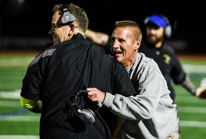 Northern Lebanon head coach Roy Wall celebrates with assistant coach Chris George as Northern Lebanon held off Lancaster Catholic 21-14 to win the Section 3 title at Lancaster Catholic on Friday, Nov. 3, 2017.