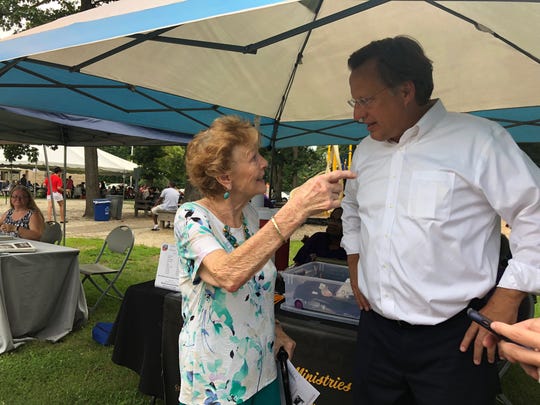 Rep. Dave Brat, R-Va., speaks with a constituent at an event in Chesterfield, Va., Aug. 7, 2018. Brat is running for re-election in a competitive race in Virginia's 7th Congressional District.