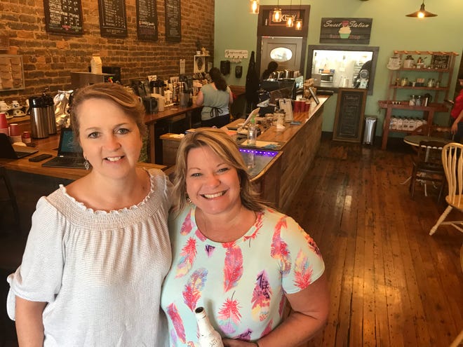 Jeanette Henning (left) and Kendra Moreau met during the Aug. 21, 2017, solar eclipse in Sweetwater, Tennessee, and now run a joint coffee and bake shop on Main Street.