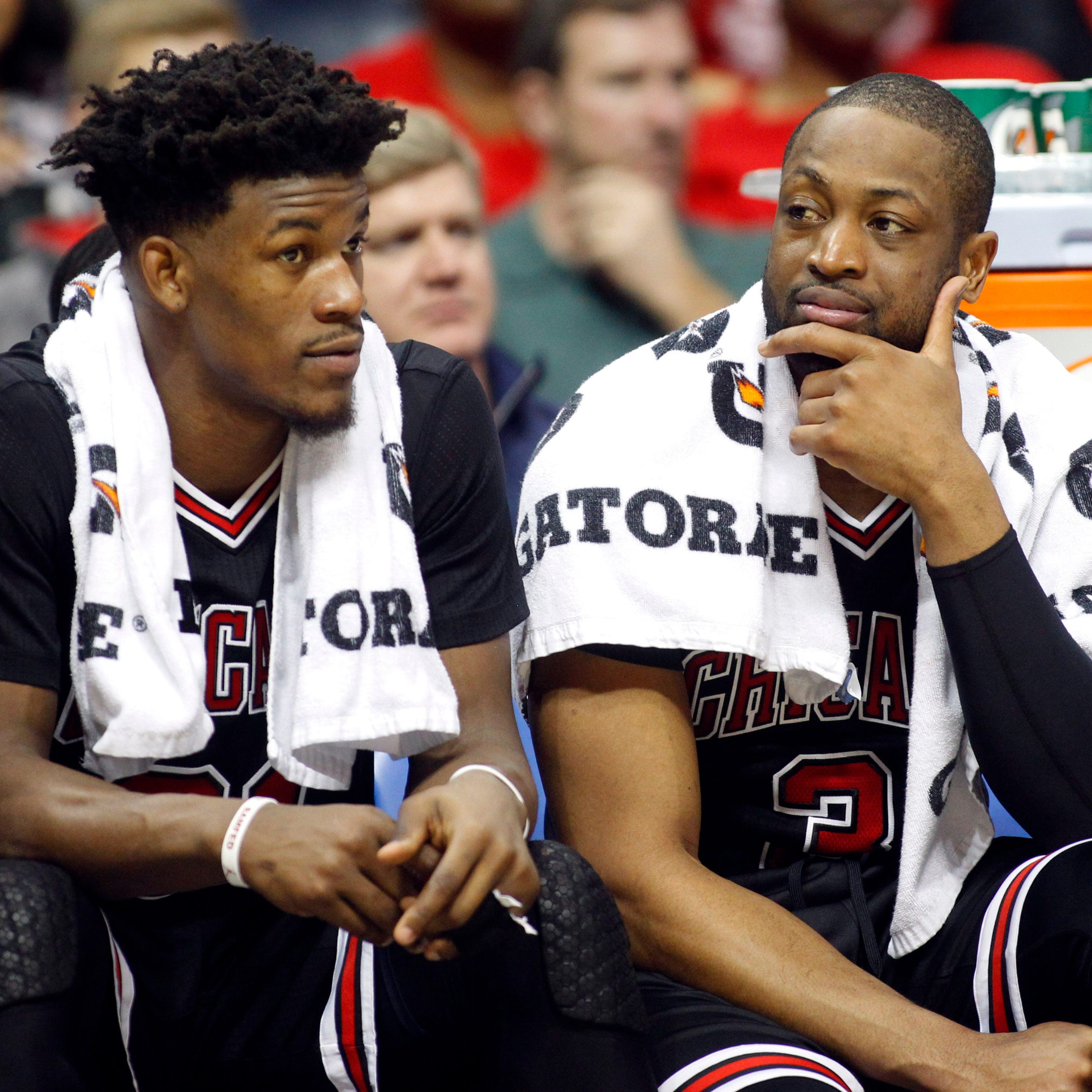 Former Chicago Bulls forward Jimmy Butler and guard Dwyane Wade talk against the Atlanta Hawks in the fourth quarter at Philips Arena in 2017.