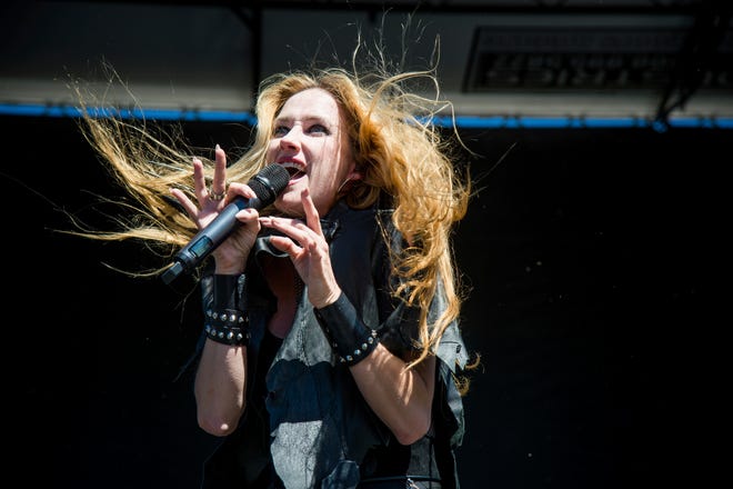 In this Sept. 24, 2016 file photo, Jill Janus of Huntress performs at Ozzfest 2016 at San Manuel Amphitheater in San Bernardino, Calif. Janus, lead singer of the heavy metal band Huntress, has died at age 43.