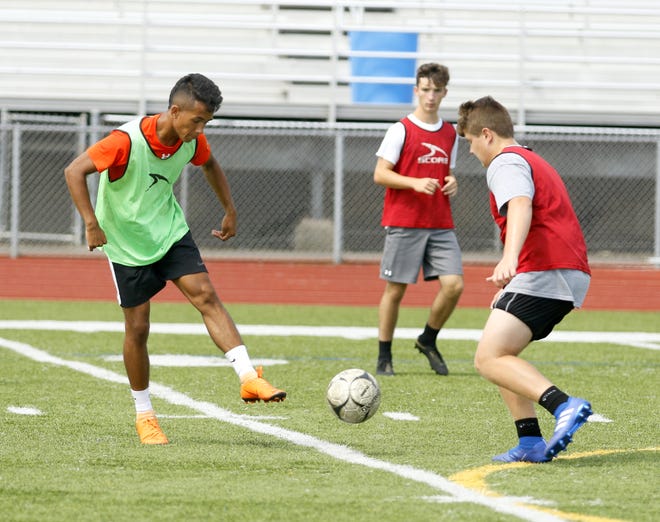 The Elmira High School boys soccer team practices Aug. 17 at Marty Harrigan Athletic Field at Ernie Davis Academy.