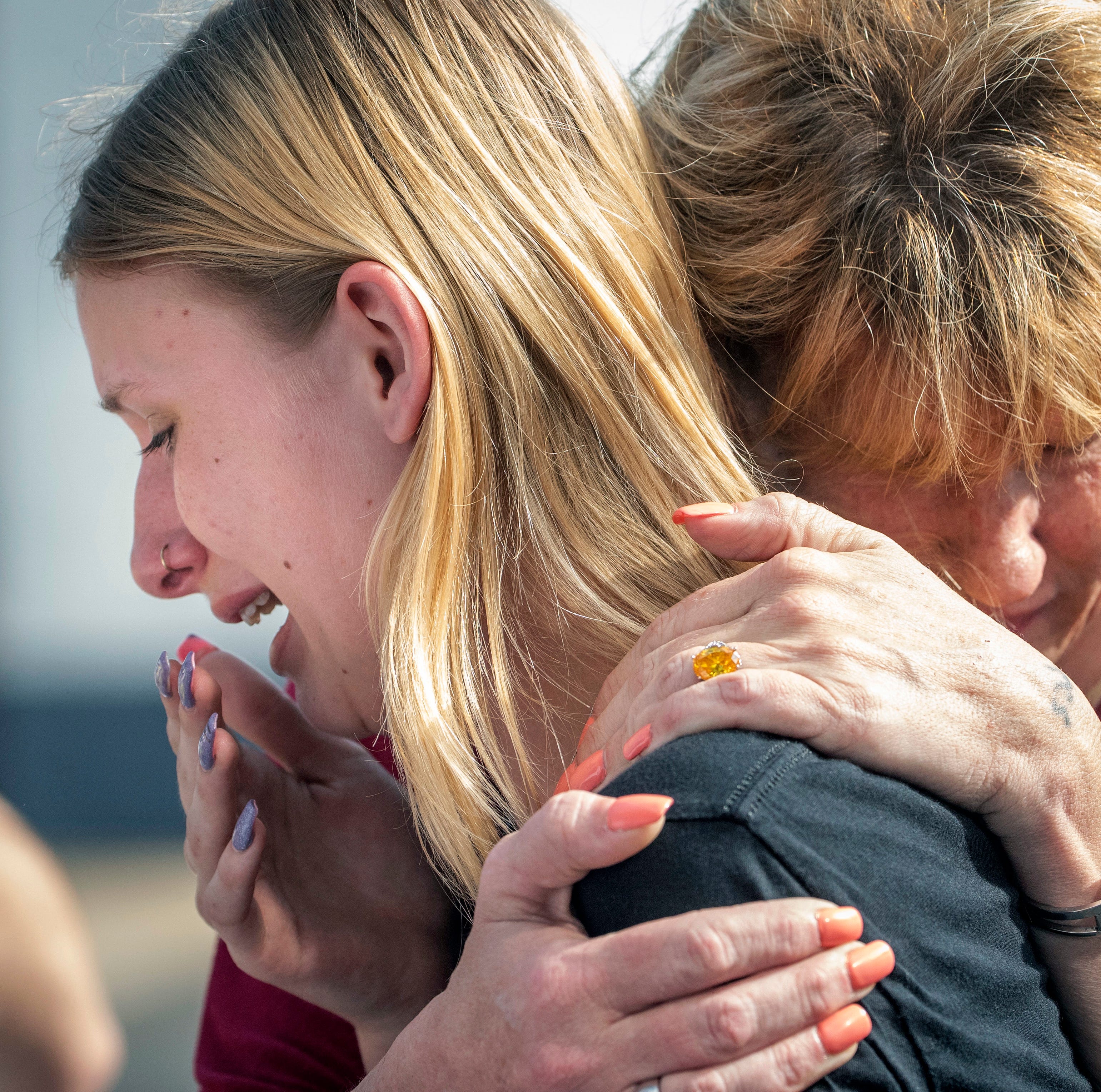 In this May 18, 2018 file photo, Santa Fe High School student Dakota Shrader is comforted by her mother Susan Davidson following a shooting at the school in Santa Fe, Texas.