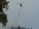 A helicopter drops water on the ridge near Bollibokka Club along the McCloud River on Saturday morning, Aug. 18, 2018. The Hirz Fire is burning in that area. (Special to the Record Searchlight/Hung T. Vu)