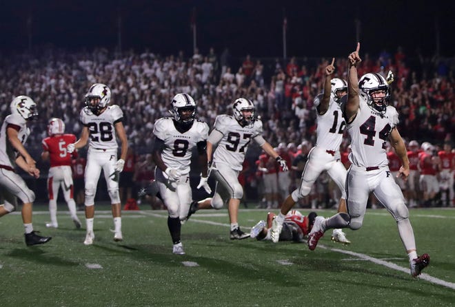 Fond du Lac players celebrate after winning their game against Kimberly with a last-second field goal Friday in Kimberly. Kimberly's loss ended their 70-game winning streak.