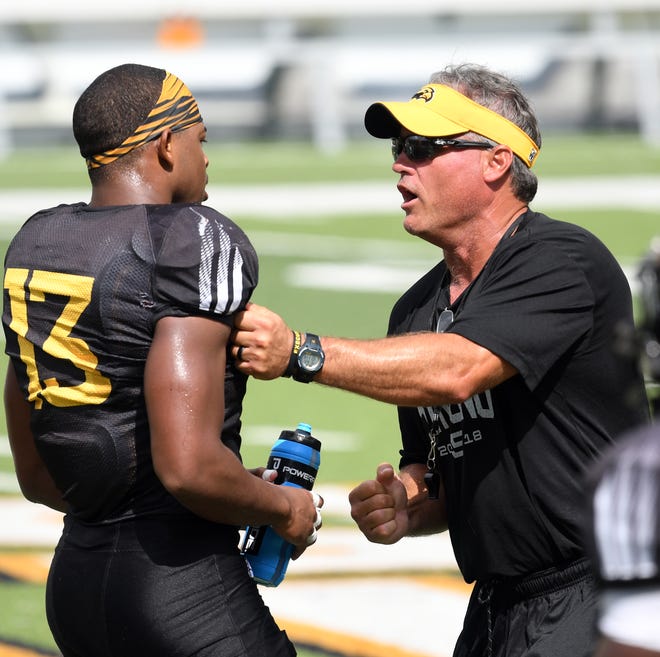 Southern Miss head coach Jay Hopson speaks to defensive back Picasso Nelson Jr. after a drill exercise during the teams last week of fall camp on Monday, August 20, 2018. 