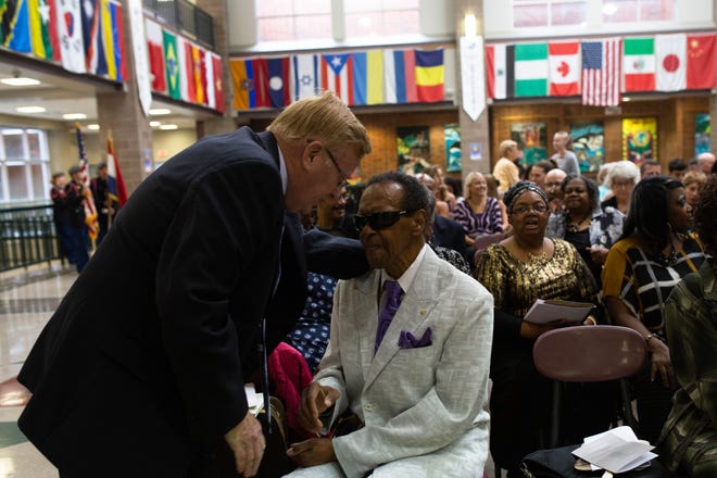Springfield Mayor Ken McClure talks with former councilman Denny Whayne at a celebration of Rev. Oliver Brown at Central High School in 2018.