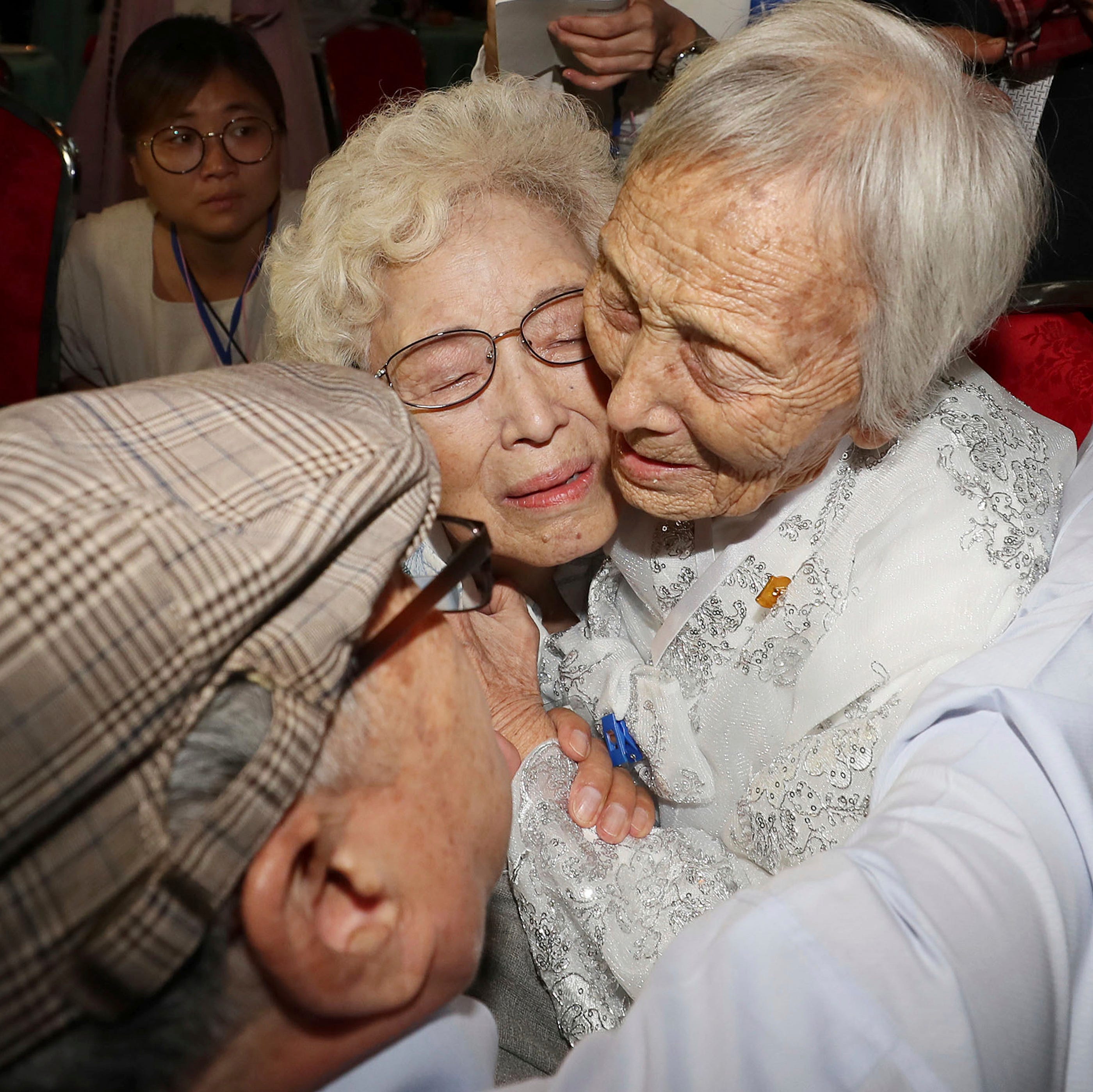 South Korean Cho Hye-do, 86, center, hugs her North Korean sister Cho Sun Do, 89, right, during the Separated Family Reunion Meeting at the Diamond Mountain resort in North Korea, Monday, Aug. 20, 2018. Dozens of elderly South Koreans crossed the hea