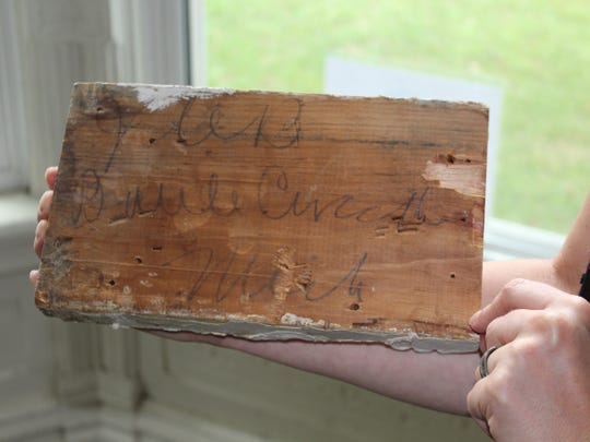 This baseboard accent piece was found at the 1870s-built home at 26 Fremont Street. It says "JCB Battle Creek, Mich.," to note who it was for, John Carlos Barber from Battle Creek.