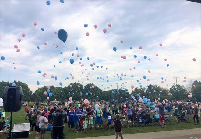 Participants in the annual Iowa SIDS Foundation's Walk for the Future release balloons in Ankeny's Wagner Park to honor babies who died as a result of sudden infant death syndrome.