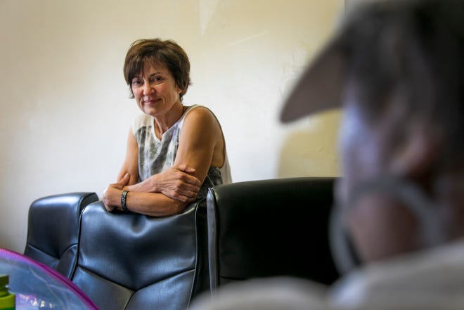 Joanne Ewald, founder of Mend On The Move, speaks with jewelry makers at Heartline Samaritas in Detroit, on August 2, 2018.