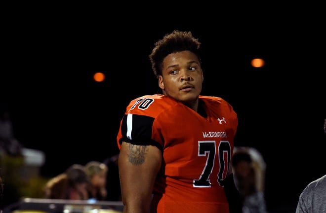 In this Sept. 16, 2016, photo, then-McDonogh high school football lineman Jordan McNair watches from the sideline during a game in McDonogh, Md. Members of the Maryland football team will wear a helmet sticker with No. 79 to honor former teammate Jordan McNair, who collapsed during a practice session in May and subsequently died. In an announcement Monday morning, Aug. 20, 2018, the school said no player will wear his number for the next three years â€” the time during which he would have been eligible to play. (Barbara Haddock Taylor/The Baltimore Sun via AP)