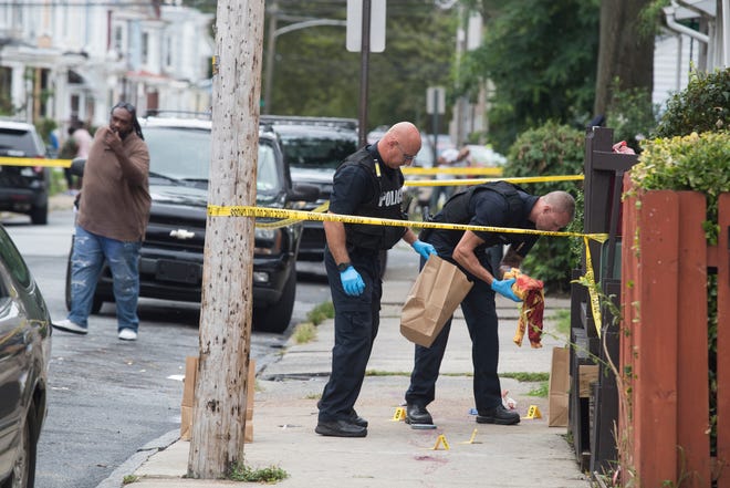 Wilmington Police investigate the scene of a shooting on the 100 block of Lamotte Street Tuesday afternoon. 