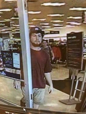 Security camera footage from Tuesday, Aug. 21, 2018, shows a man leaving Marshalls department store in Williston, Vermont. Police asked the public Wednesday for help identifying the man suspected 'upskirting' a woman in the store.