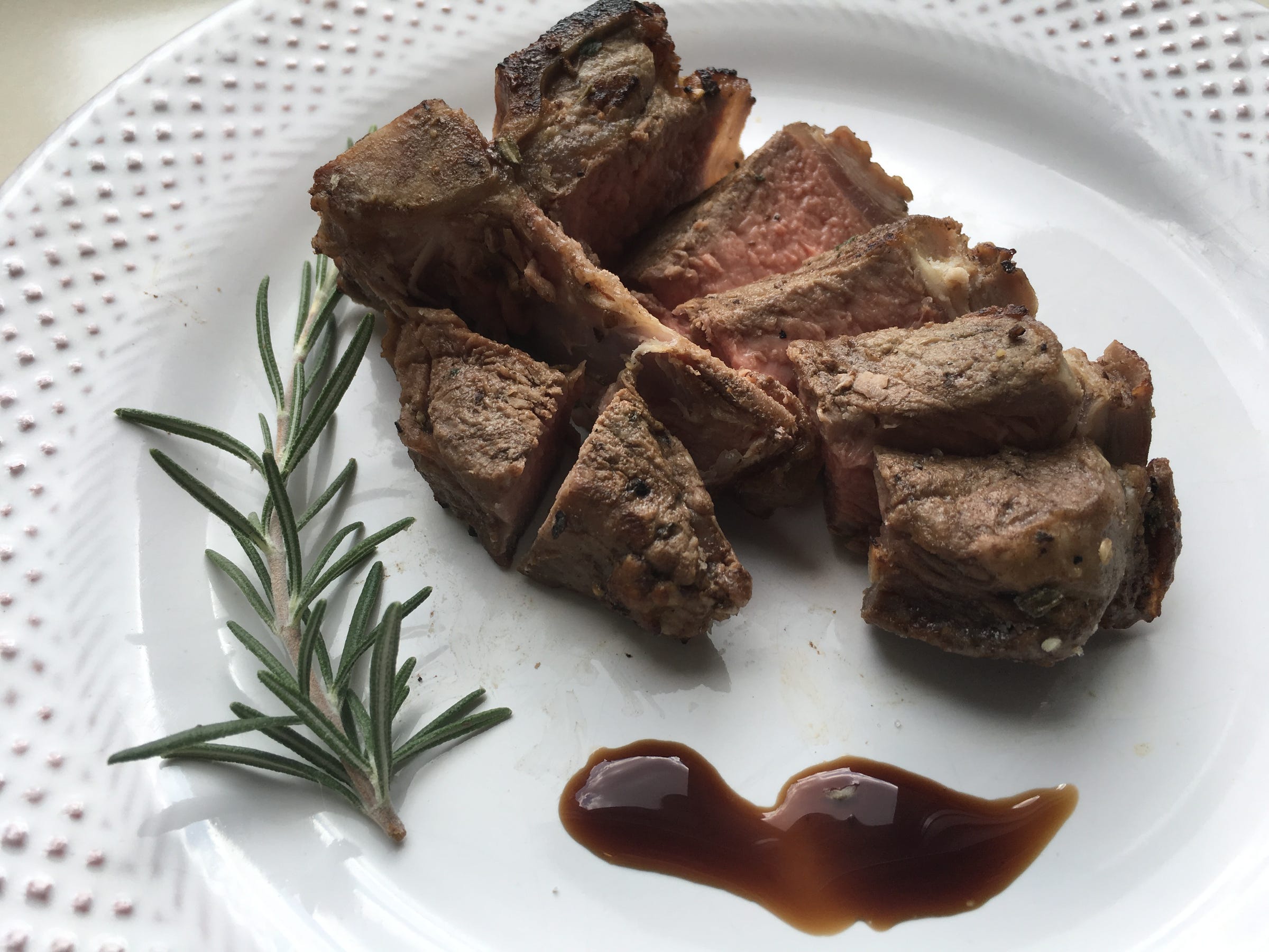 Garlic, Rosemary and Thyme Marinated Lamb Chops cut like a porterhouse steak.