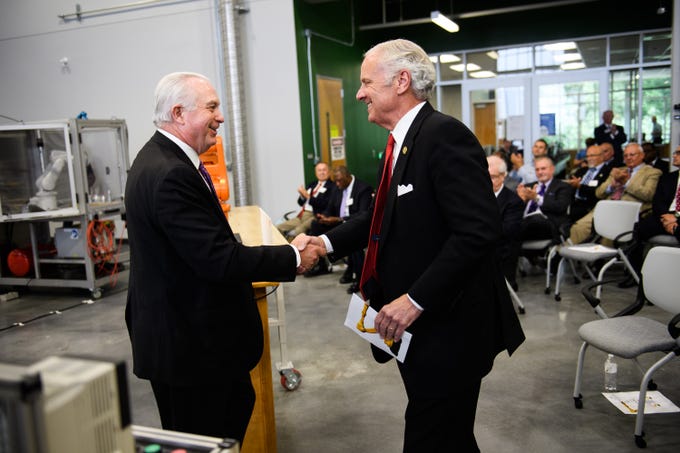 Gov. Henry McMaster shakes hands with Greenville Technical College president Dr. Keith Miller during an event at the school's Center for Manufacturing Innovation on Wednesday, Aug. 22, 2018.
