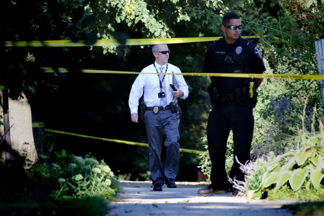 Crime scene investigators respond to a home in the 7900 block of Warren Avenue in Wauwatosa following reports of shots fired on Aug. 22. The Milwaukee County Medical Examiner was notified. A neighbor to the scene arrived to get items from her home.