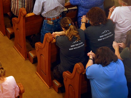 Community members gather for a prayer service in honor of Mollie Tibbetts at St. Patrick Church in Brooklyn Iowa Aug. 22, 2018.