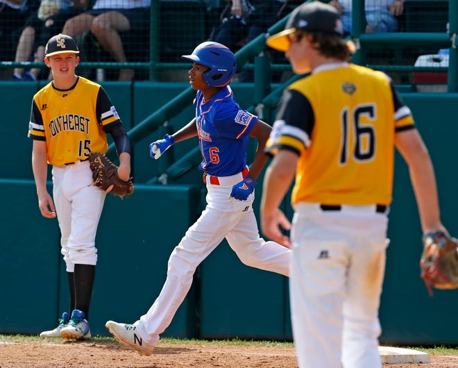 Grosse Pointe Woods-Shores's Jarren rounds first base after hitting a solo home run in the third inning of Wednesday's elimination game at the Little League World Series.