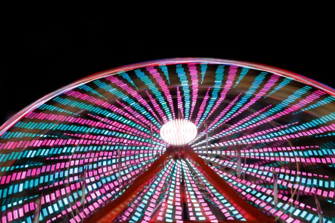 This year's Central Wisconsin State Fair in Marshfield featured an 85-foot-high Ferris wheel. The ride lit up the night sky with colors Wednesday, August 22, 2018. 