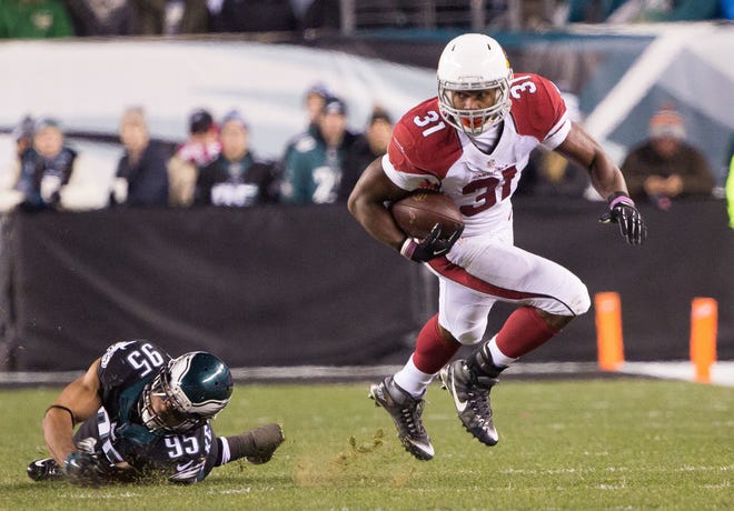 Dec 20, 2015; Philadelphia, PA, USA; Arizona Cardinals running back David Johnson (31) makes a reception and breaks the tackle attempt of Philadelphia Eagles inside linebacker Mychal Kendricks (95) during the first half at Lincoln Financial Field.