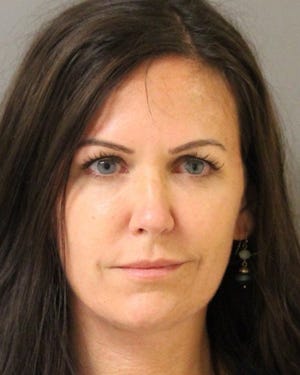 44-year-old Melanie Ballard of Smyrna has been arrested after police say she pointed a loaded handgun at her former tenant.
