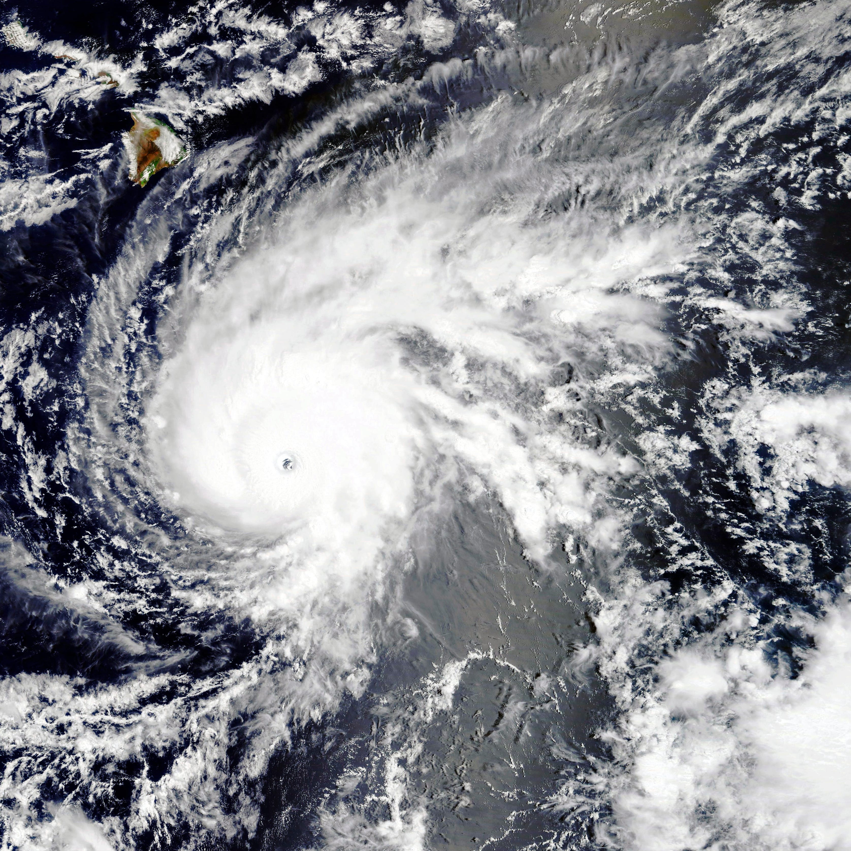This NASA satellite image, released on Tuesday, shows Hurricane Lane near the Big Island of Hawaii (upper left).