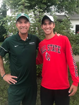 In this file photo, then-Michigan State men's tennis coach Gene Orlando (left) stands with son, Vince. Gene Orlando on Saturday announced his retirement after 31 years leading the program.